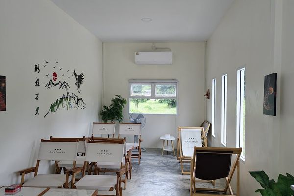 Serene person meditating in a minimalist room with natural light